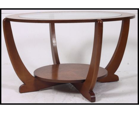 A vintage teak 1970's atomic style oak quarter veneer round coffee table with glass insert top and lower shelf. 45x77cm