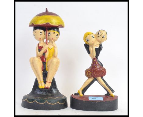 Two vintage style Art Deco inspired cast iron painted doorstops. 
