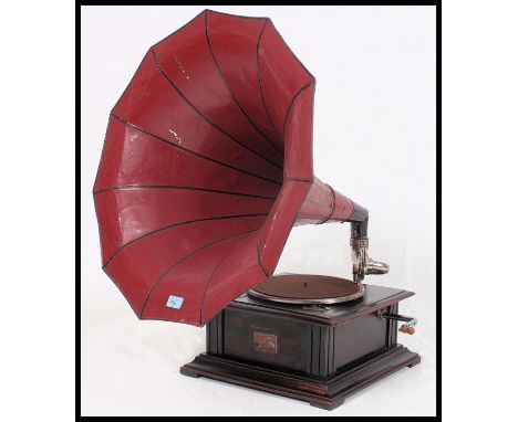  A vintage oak cased HMV His Masters Voice gramaphone, with painted a painted metal Morning Glory horn with oak cased record 