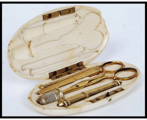 A 19th century ivory cased sewing set, the ivory case of lozenge form being, monogrammed to the lid. The interior with gilded