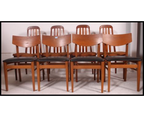 Two sets of retro dining chairs the first set having vinyl seats with wooden back rests and the other set of four chairs havi