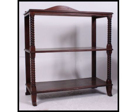A 19th century mahogany inlaid dumbwaiter buffet. Raised on barleytwist columns with 3 tiers having stage gallery top above. 