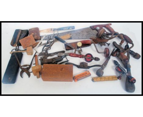 A collection of vintage wood working hand tools to include saw, drills etc please see images
