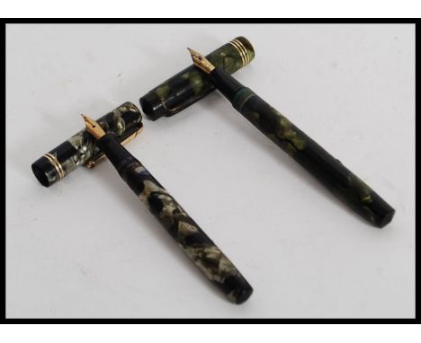 A vintage Swan Mabie Todd Ltd self filler green marble fountain pen,           with 14ct gold nib. Together with a Burnham gr