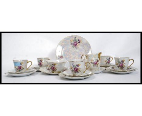 A 20th century Czech lusterware tea service to include cups, saucers and plates etc being stamped to the underside