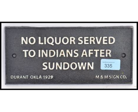A vintage style reproduction metal sign ' No Liquor Served To Indians After Sundown ' 