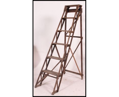 An early 20th century wooden trellis - lattice worked Industrial step ladder called - The Hatherley Ladderstep. Ideal as conv