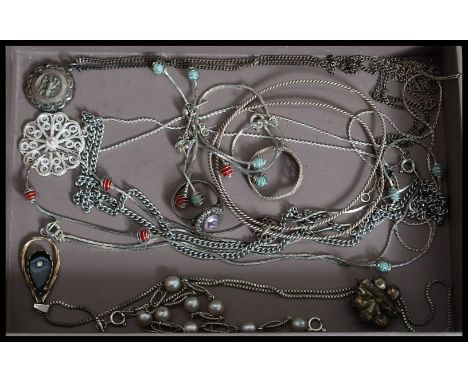 A collection of silver and white metal necklaces to include 925 silver pendant, filigree etc. also 925 silver amethyst ring a