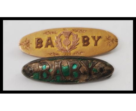 A 9ct gold sweetheart brooch ' Baby ' brooch together with a silver hallmarked enamel set Baby brooch. Weight of golf brooch 