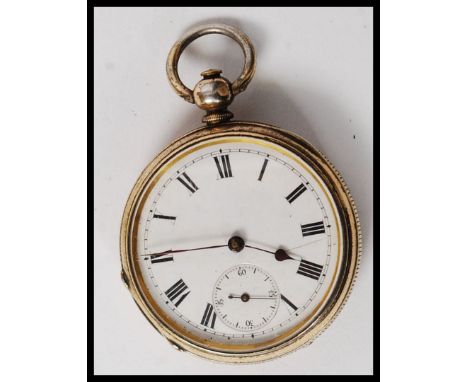 A white metal ( marked ' fine silver ' ) enamel faced pocket watch. 