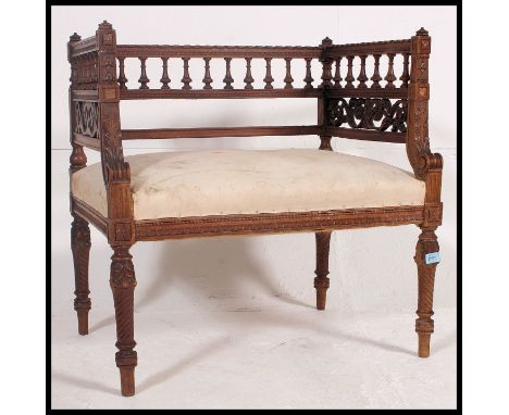 An early 20th century carved walnut Italian window seat. Raised on carved tapered legs with stunning spindle gallery surround