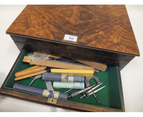 A WALNUT CASE CONTAINING VINTAGE WOOD WORKING TOOLS ETC