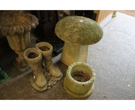 A STONE GARDEN MUSHROOM TOGETHER WITH A SMALL PLANTER AND BOOT DESIGN PLANTER