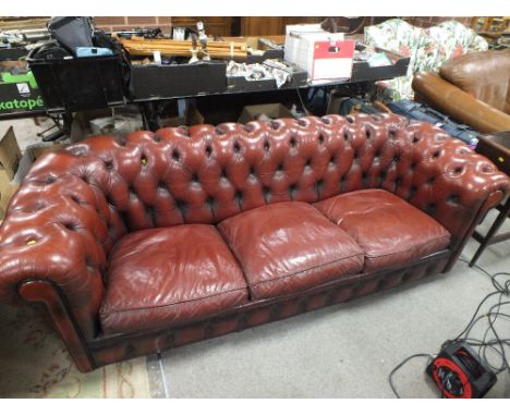 AN OXBLOOD RED LEATHER CHESTERFIELD SOFA W 240 CM