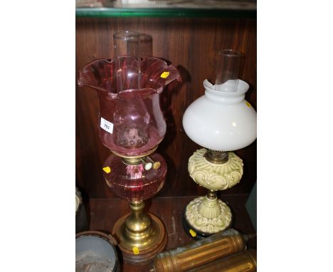 A VINTAGE PINK GLASS OIL LAMP TOGETHER WITH ANOTHER