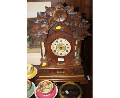 A VINTAGE CARVED OAK COMBINATION CLOCK WITH CHERUBIC BRASS DIAL A/F 
