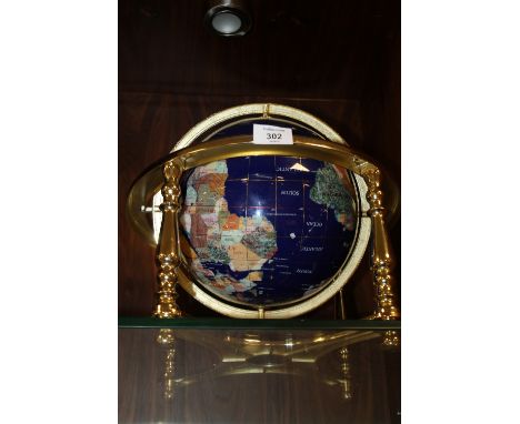 A MODERN GEM STONE GLOBE ON STAND