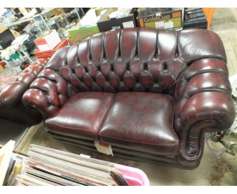 AN OXBLOOD RED LEATHER 'THOMAS LLOYD' CHESTERFIELD TYPE SOFA W 180 CM 