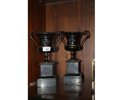 A PAIR OF SLATE MANTLE CLOCK GARNISHES
