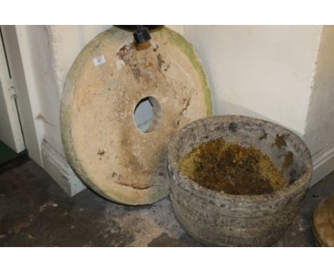 A GRINDING WHEEL TOGETHER WITH A CIRCULAR PLANTER
