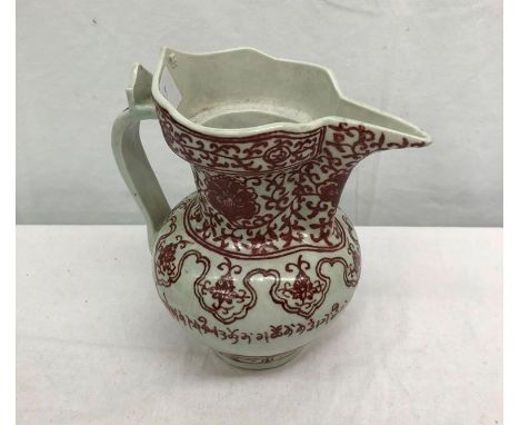 A red and white Tibetan teapot