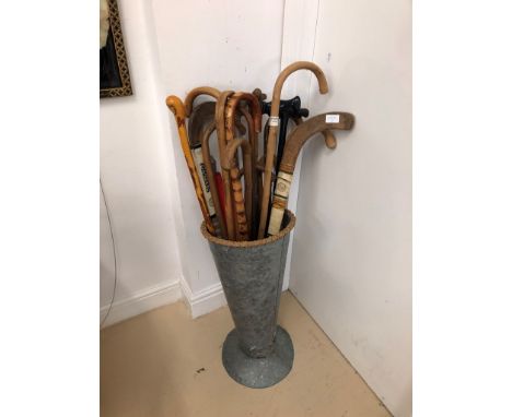 A zinc walking stick stands and sticks: hockey etc