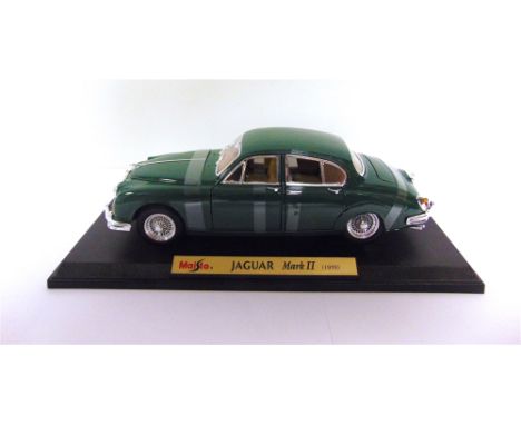 A 1/18 SCALE MAISTO NO.31833, JAGUAR MARK II (1959) green, mint or near mint and boxed. Condition Report : Box window with pi