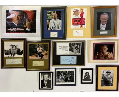 A collection of signed framed items displaying autographs from TV and film stars such as Tom Hanks, Whoopi Goldberg, Michael 