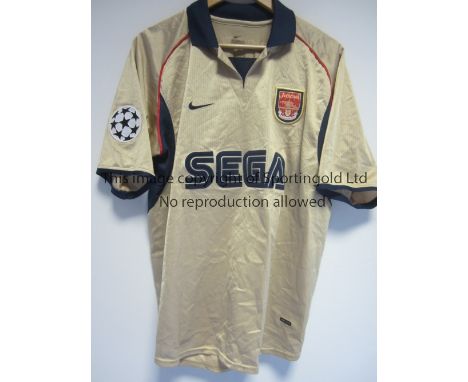 ARSENAL     A Nike gold with short sleeves away shirt 2001 - 2002 with Sega shirt sponsor and one Champions League arm flash,