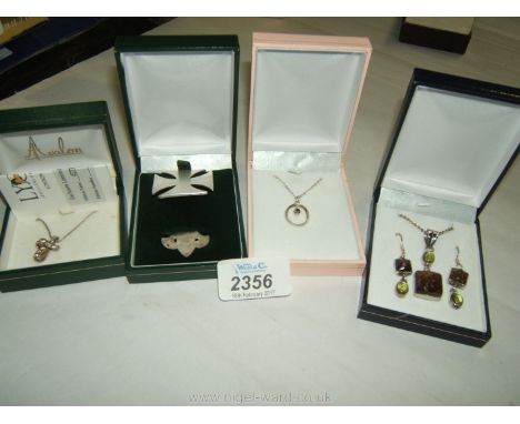A Sterling silver and ruby Necklace and pendant, boxed 725 necklace and ear-rings with green stones, silver Cross marked H.M 