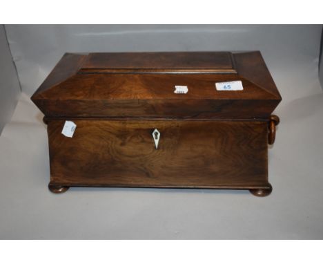 A fine Georgian casket form Walnut cased tea caddy with bun feet carved wood handles and complete compartmental inner.