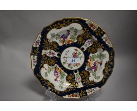 A first period Worcester dish highly decorated with gilt and cobalt with three medallions of exotic birds. With fretted squar