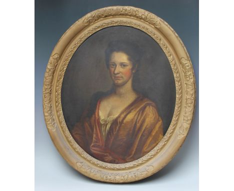 AFTER FOLLOWER OF SIR PETER LELY - A CLASSICAL HALF LENGTH FEMALE PORTRAIT, oval oil on canvas, gilt frame, bearing Christies