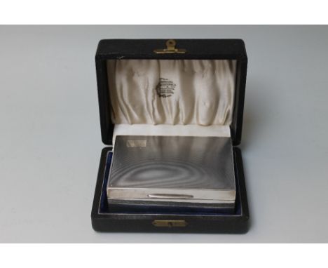 A HALLMARKED SILVER CIGARETTE BOX - BIRMINGHAM 1949, with engine turned lid and plain panel sides, W 12.25 cm
For shipping pr