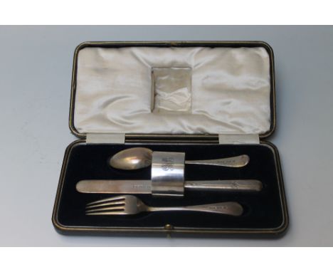 A MATCHED HALLMARKED SILVER CHRISTENING SET IN PRESENTATION BOX, the spoon, knife and fork all matching Sheffield 1925, maker