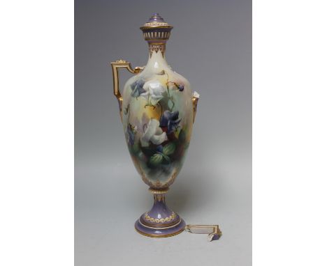 A ROYAL WORCESTER SLENDER TWIN HANDLED VASE AND COVER, signed by C.V. White, the body decorated with flowers, raised on a ped