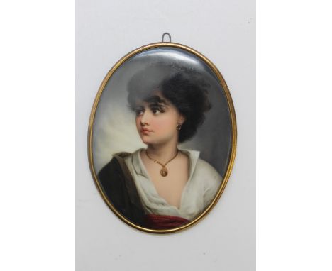 A 'BERLIN' STYLE OVAL PORCELAIN PLAQUE, depicting a half length portrait of a lady, with dark hair, possibly dressed in Greek