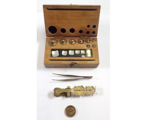 A box of gold weights (grams), a crown warranted sovereign scale, sovereign weight 