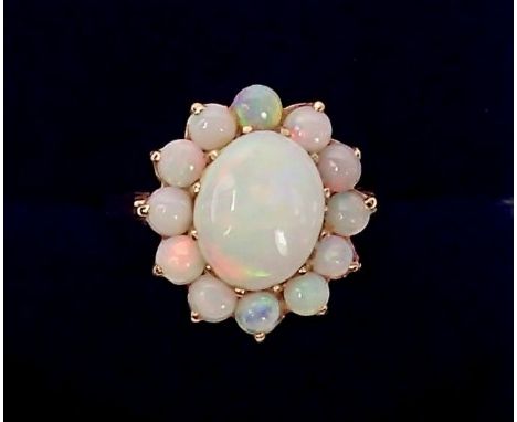 A 9 carat gold opal cluster ring, Sheffield 1976, size L, 3.2g total weight 