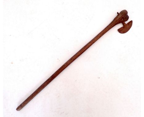 A tribal axe with wooden handle, 68cm long&nbsp;(Due to recent postal restrictions we can pack bladed items but the buyer wil