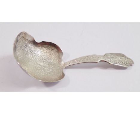 A silver caddy spoon, York 1828 by Barber, Cattle &amp; North with all over stippled decoration 