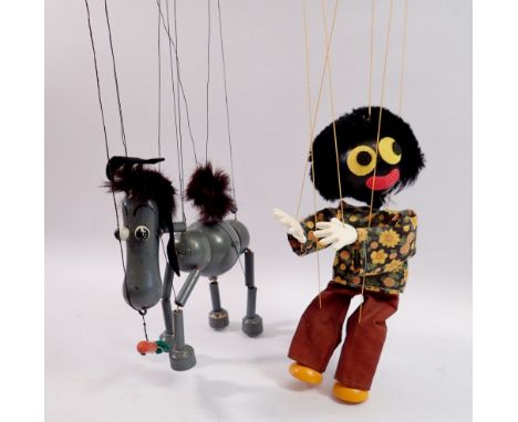 A Pelham puppet grey donkey with carrot, boxed and a Golly puppet Notice from the the-saleroom.com: These items are listed on