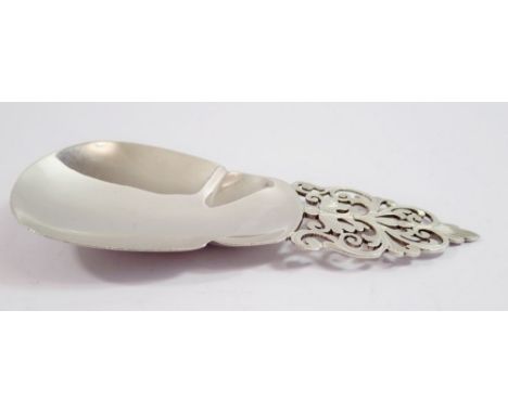 A large silver caddy spoon, Sheffield 1897 by Mappin &amp; Webb with pierced handle, 11cm long 