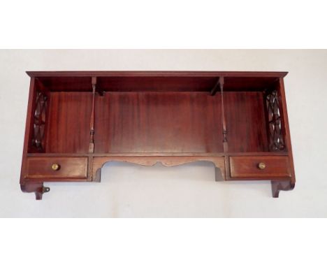 An Edwardian mahogany display shelf with pierced sides and two small drawers to apron, 84 x 35cm 