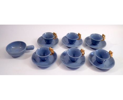 A blue pottery set of six coffee cups and saucers with gilt sea horse handles and a Gallo wine taster 