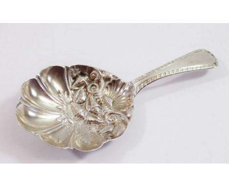A silver caddy spoon, London 1790 by Henry Green with fluted bowl embossed shells 