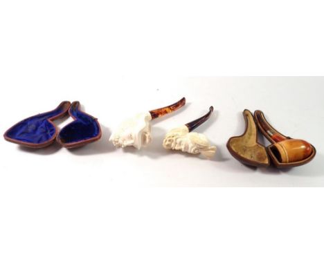 Three various pipes and a pipe case 