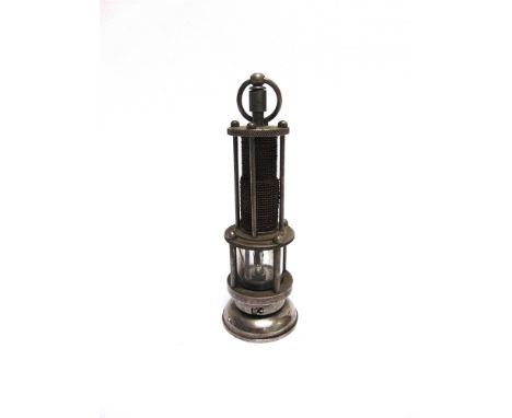 A NOVELTY CIGARETTE LIGHTER IN THE FORM OF A MINER'S LAMP  17cm high.