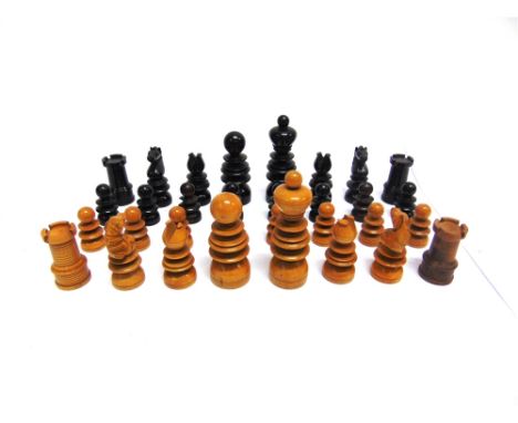 A ST. GEORGE PATTERN BOXWOOD & EBONY CHESS SET  unsigned, the kings 80mm high, contained in a printed tin tea caddy (some pie