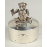 A novelty silver articulated teddy bear circular pill box, 3cm.